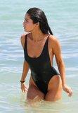 PAY-Selena-Gomez-looks-sexy-yet-classy-in-a-black-one-piece-swimsuit-on-the-beach-in-Miami.jpg