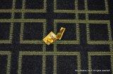 133-Condom wrapper on patterned hotel carpet.JPG