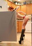 Sexy High heeled booted babe in the fridge.jpg