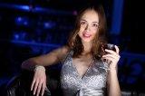 3301924-173871-young-woman-in-evening-dress-in-night-club-with-a-*******.jpg