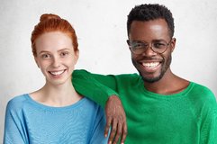 z-mixed-race-relations-concept-delihghted-happy-black-and-white-female-and-man-wear-bright-swe...jpg