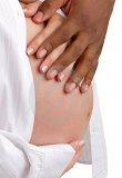 hands-mixed-race-couple-pregnant-belly-22461883.jpg