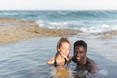 young-black-man-white-woman-bathing-sea_154439-2333.jpg