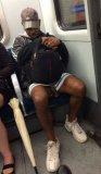 pic1_black_dude_flashing_fat_cock_hanging_out_of_shorts_on_tram_in_public_001.jpg
