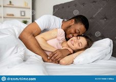 loving-multiracial-couple-cuddling-bed-home-hugging-each-other-having-intimate-foreplay-waking...jpg