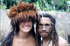 Papuan Tribal Warrior with White Women.jpg