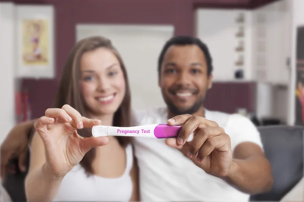 depositphotos_89264104-Interracial-couple-looking-at-pregnancy-test.jpg
