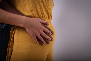 closeup-hands-black-man-who-touches-belly-white-woman-interracial-couple-is-pregnant-expecting-child_404612-359.jpg