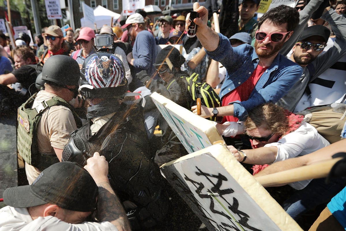 the-clashes-between-the-white-nationalists-and-the-counter-protesters-quickly-turned-violent--here-one-of-the-protesters-hits-another-with-pepper-spray.jpg