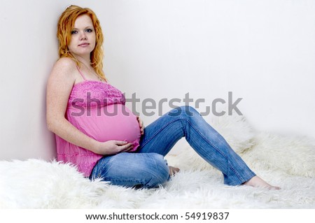 stock-photo-redhead-pregnant-woman-look-at-the-camera-54919837.jpg