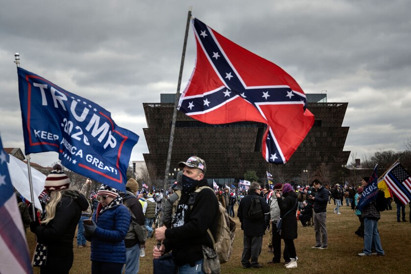 A man carries a confederate flag on the National Mall
